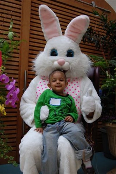 The Easter Bunny spends some time to taking photographs with the children.